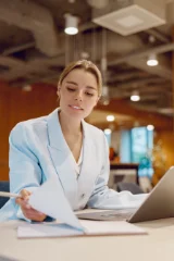 Woman looking at paperwork, studying - part of multiframe pictures