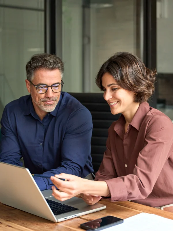 A professional discovering key topics of the Dynamics 365 CRM Learning Journey on a laptop indoors