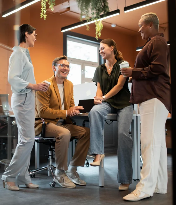 A group of professionals discussing the new insights they gained from a Learning Journey
